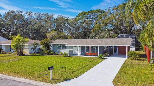 2042 Craft Ln, Sarasota, FL 34239 - single story home featuring roof with shingles, stucco siding, a front yard, concrete driveway, and a carport