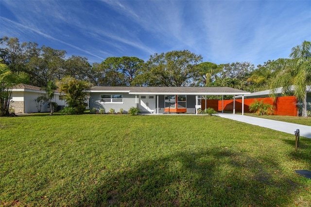 2042 Craft Ln, Sarasota, FL 34239 - view of front of property featuring an attached carport, fence, driveway, and a front lawn