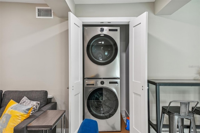 2042 Craft Ln, Sarasota, FL 34239 - washroom with visible vents, stacked washer and dryer, and laundry area