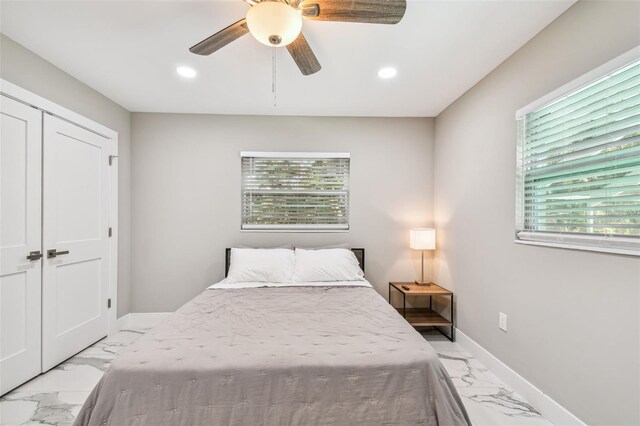 2042 Craft Ln, Sarasota, FL 34239 - bedroom with recessed lighting, marble finish floor, and multiple windows