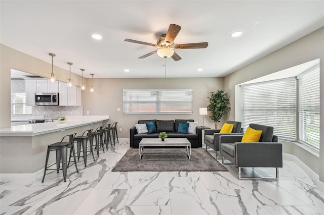 2042 Craft Ln, Sarasota, FL 34239 - living area featuring recessed lighting, ceiling fan, baseboards, and marble finish floor