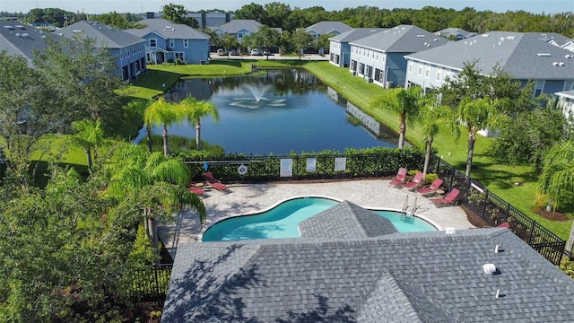 bird's eye view with a residential view and a water view