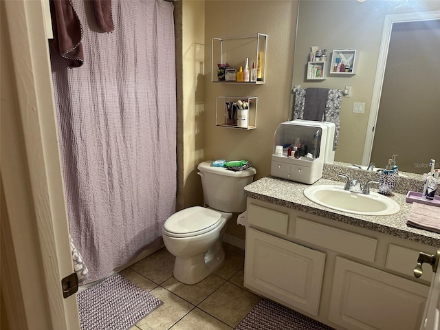bathroom featuring vanity, tile patterned flooring, toilet, and a shower with shower curtain