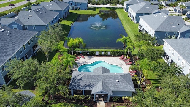 bird's eye view featuring a water view and a residential view
