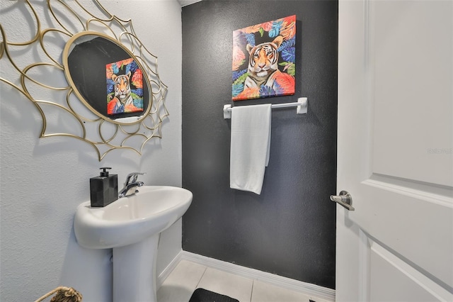 bathroom with tile patterned floors and baseboards