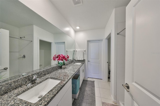 bathroom featuring visible vents, a sink, and toilet