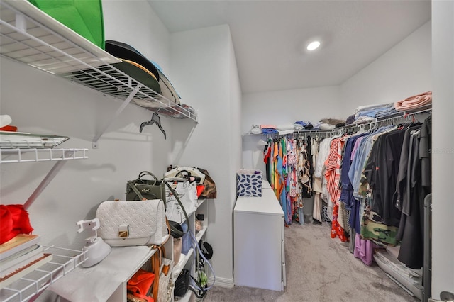 walk in closet with carpet floors