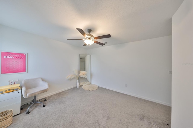 living area featuring baseboards, carpet, ceiling fan, and visible vents