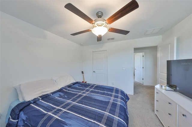 bedroom with baseboards, visible vents, ceiling fan, and light colored carpet