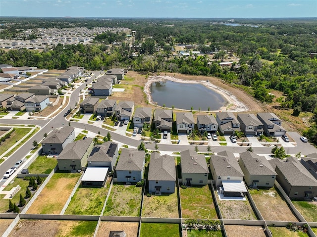 drone / aerial view featuring a residential view and a water view