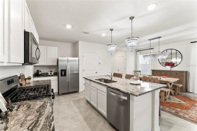 35780 Sunflower Hill Dr, Zephyrhills, FL 33541 - kitchen with light stone counters, a sink, stainless steel appliances, recessed lighting, and visible vents