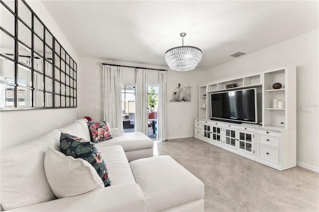35780 Sunflower Hill Dr, Zephyrhills, FL 33541 - living room featuring visible vents, baseboards, light tile patterned floors, and a chandelier