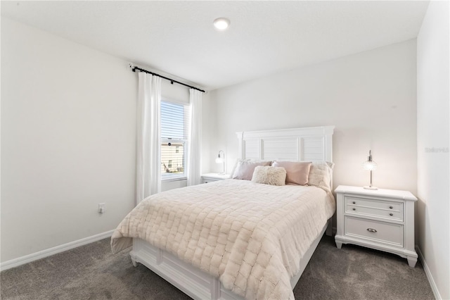 35780 Sunflower Hill Dr, Zephyrhills, FL 33541 - bedroom featuring baseboards and dark carpet