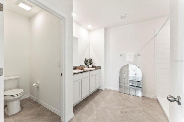 35780 Sunflower Hill Dr, Zephyrhills, FL 33541 - full bath featuring vanity, toilet, tile patterned floors, baseboards, and visible vents