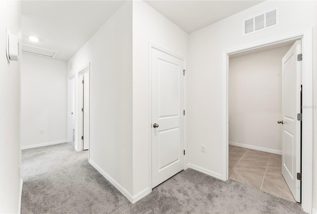 35780 Sunflower Hill Dr, Zephyrhills, FL 33541 - corridor featuring baseboards, carpet, attic access, and visible vents