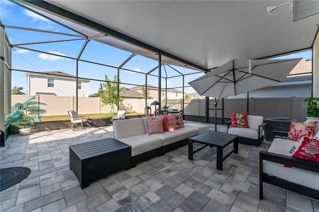 35780 Sunflower Hill Dr, Zephyrhills, FL 33541 - view of patio featuring a lanai, an outdoor hangout area, and a fenced backyard