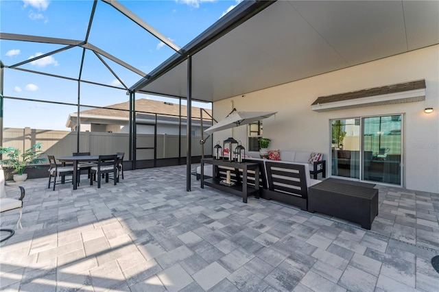 35780 Sunflower Hill Dr, Zephyrhills, FL 33541 - view of patio / terrace featuring fence, a lanai, outdoor dining area, and outdoor lounge area