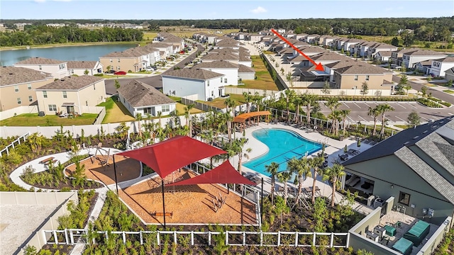35780 Sunflower Hill Dr, Zephyrhills, FL 33541 - drone / aerial view with a water view and a residential view