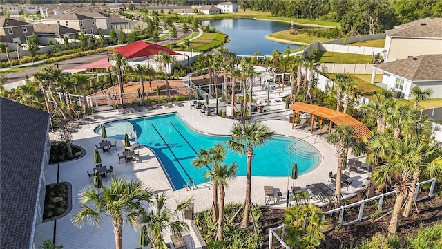 35780 Sunflower Hill Dr, Zephyrhills, FL 33541 - community pool with a water view, fence, and a patio area