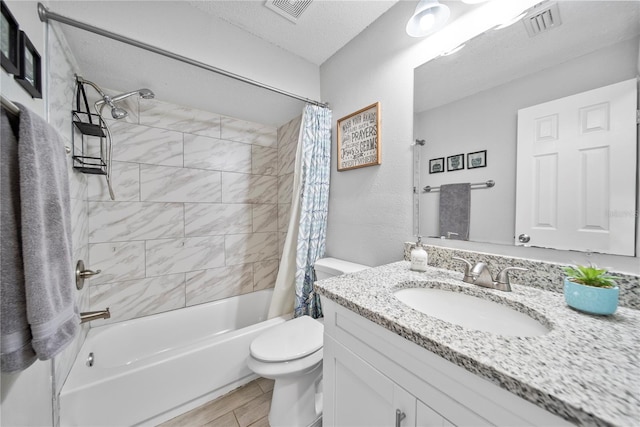 full bath with toilet, vanity, visible vents, and shower / bathtub combination with curtain