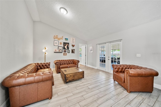 living room featuring french doors, a textured ceiling, wood finish floors, vaulted ceiling, and baseboards