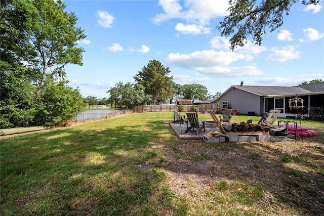 view of yard featuring a fire pit and fence