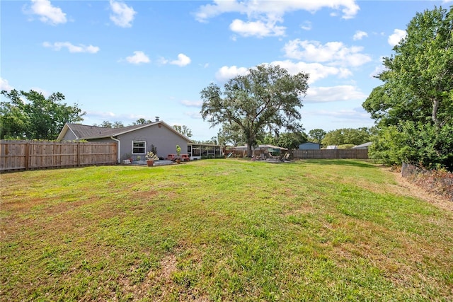 view of yard with a fenced backyard