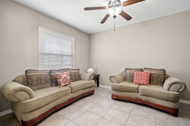 6708 Hazelnut Spice Dr, Ruskin, FL 33573 - living area featuring light tile patterned flooring, ceiling fan, and baseboards