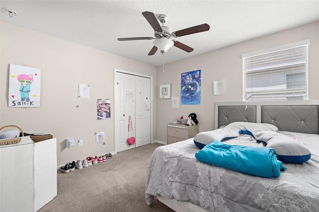 6708 Hazelnut Spice Dr, Ruskin, FL 33573 - bedroom with carpet floors, a textured ceiling, a ceiling fan, baseboards, and a closet