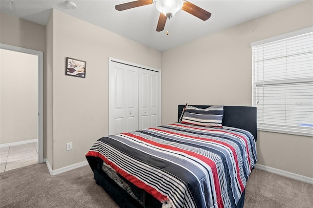 6708 Hazelnut Spice Dr, Ruskin, FL 33573 - bedroom featuring baseboards, ceiling fan, carpet, and a closet