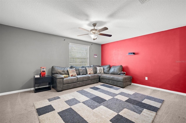 6708 Hazelnut Spice Dr, Ruskin, FL 33573 - carpeted living room with a textured ceiling, ceiling fan, and baseboards
