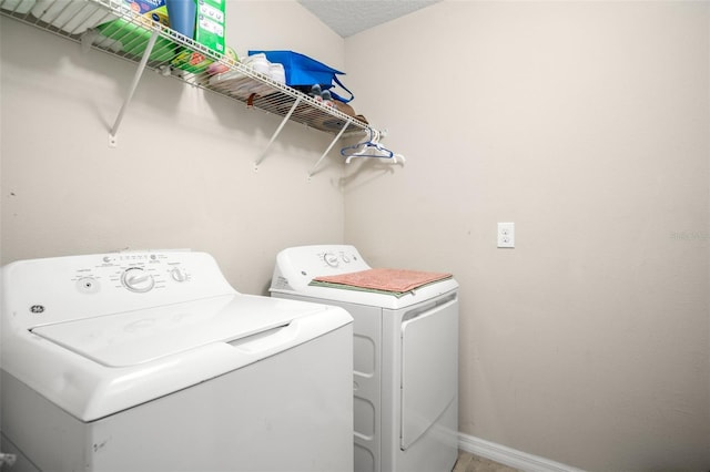 6708 Hazelnut Spice Dr, Ruskin, FL 33573 - clothes washing area featuring baseboards, laundry area, and independent washer and dryer