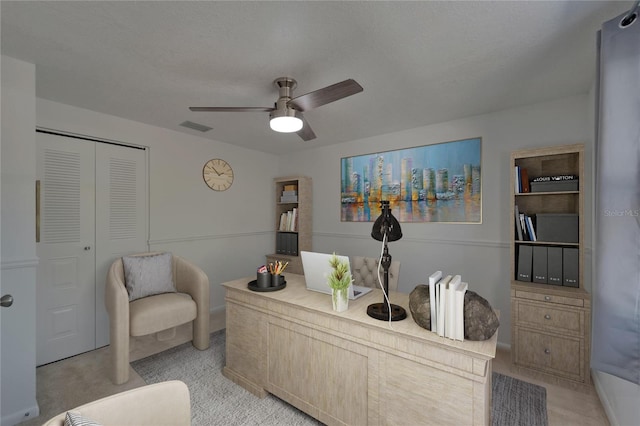 interior space featuring a ceiling fan, baseboards, visible vents, and light carpet