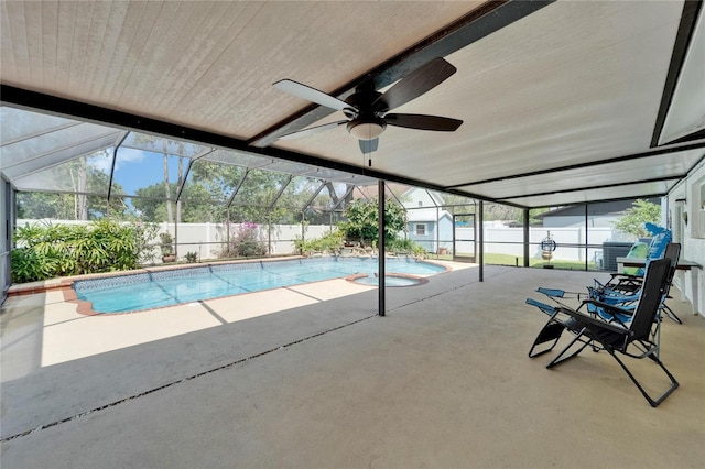 view of pool with a patio, a fenced backyard, glass enclosure, and a fenced in pool