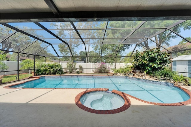 view of pool with a fenced backyard, a patio, a pool with connected hot tub, and a lanai
