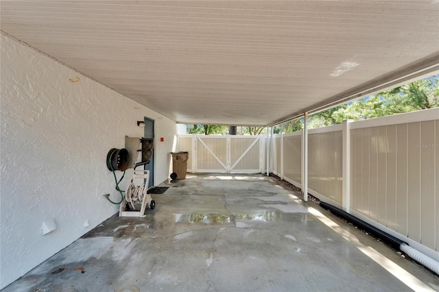 view of patio with fence and a gate