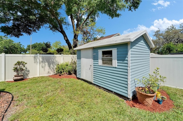 view of shed featuring a fenced backyard