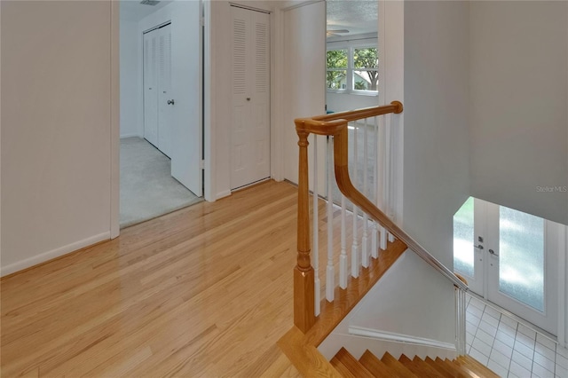 9410 Alanbrooke St, Temple Terrace, FL 33637 - stairs with wood finished floors and ceiling fan