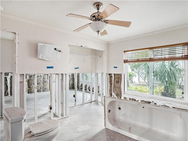 full bath featuring finished concrete flooring, a ceiling fan, ornamental molding, and a jetted tub