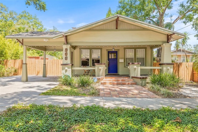906 E Broad St, Tampa, FL 33604 - view of front of house featuring covered porch and driveway