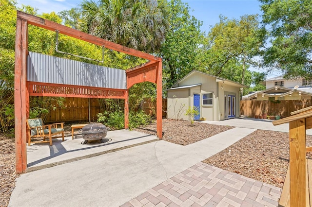 906 E Broad St, Tampa, FL 33604 - view of patio / terrace featuring an outdoor fire pit and an outdoor structure