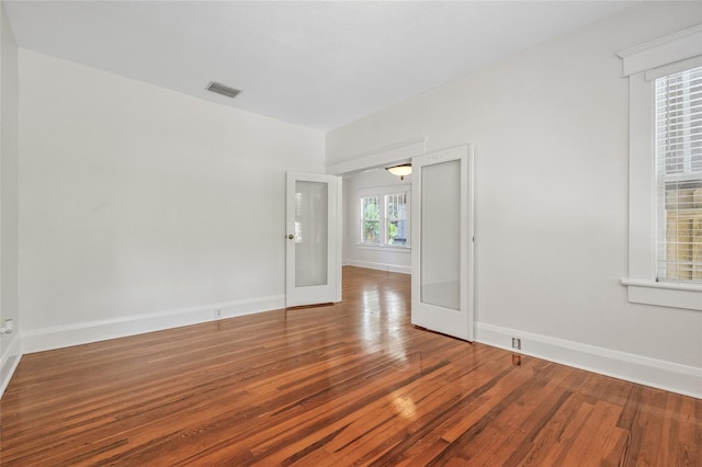 906 E Broad St, Tampa, FL 33604 - spare room featuring wood finished floors and baseboards