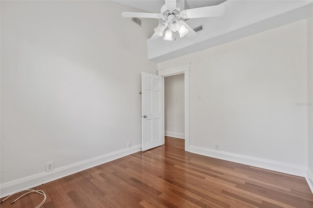 906 E Broad St, Tampa, FL 33604 - unfurnished room featuring wood finished floors, a ceiling fan, and a high ceiling