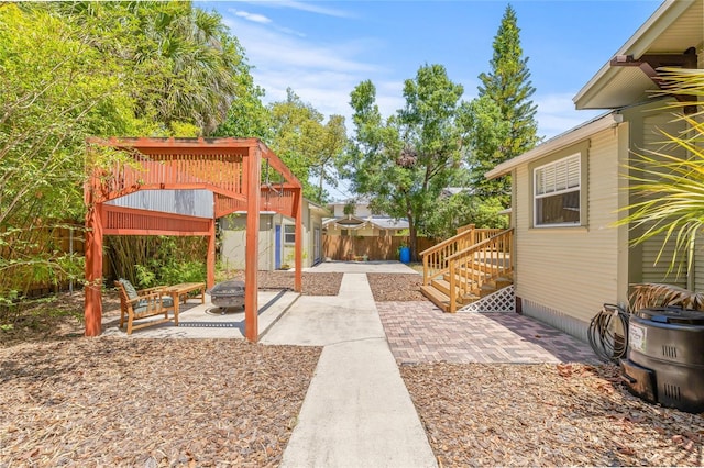 906 E Broad St, Tampa, FL 33604 - view of yard with a fire pit and a patio area