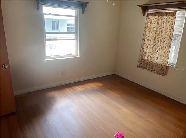 2435 37th Ave N, Saint Petersburg, FL 33713 - empty room with wood finished floors and baseboards