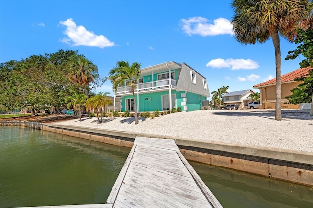 3021 Alton Dr, St Pete Beach, FL 33706 - dock area featuring a water view and a balcony