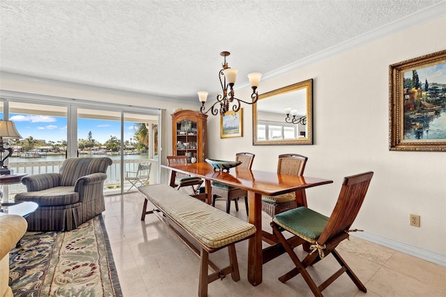 3021 Alton Dr, St Pete Beach, FL 33706 - dining room with a textured ceiling, a chandelier, ornamental molding, a water view, and baseboards