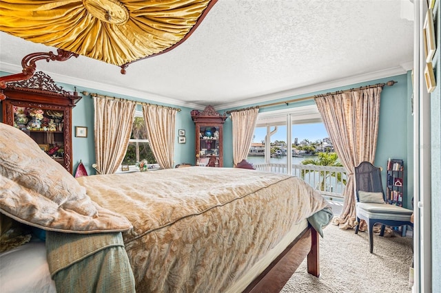 3021 Alton Dr, St Pete Beach, FL 33706 - bedroom featuring a water view, ornamental molding, multiple windows, access to outside, and a textured ceiling