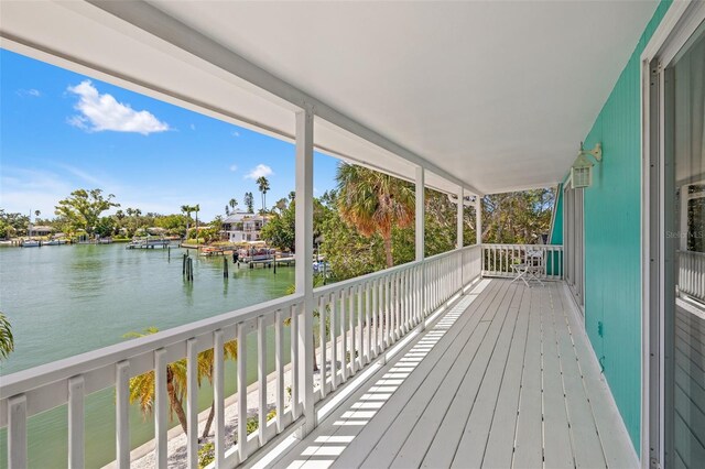 3021 Alton Dr, St Pete Beach, FL 33706 - wooden deck with a water view