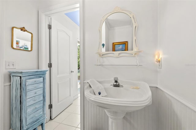 3021 Alton Dr, St Pete Beach, FL 33706 - bathroom with a wainscoted wall and tile patterned flooring
